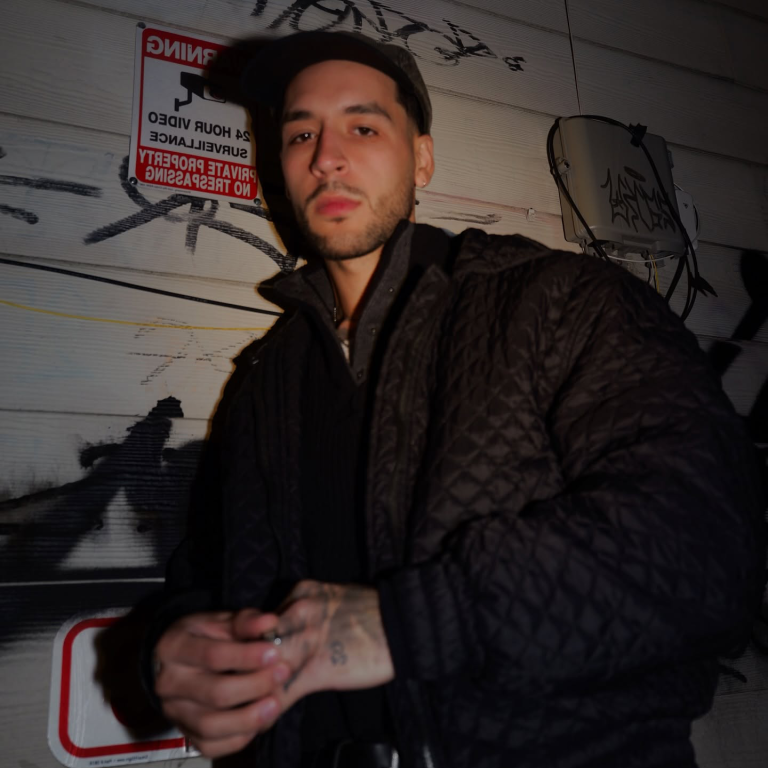 The face of BYMS, photographed in a black jacket.